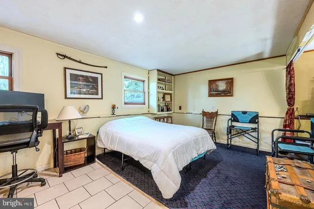 a bed room with a bed and a tv