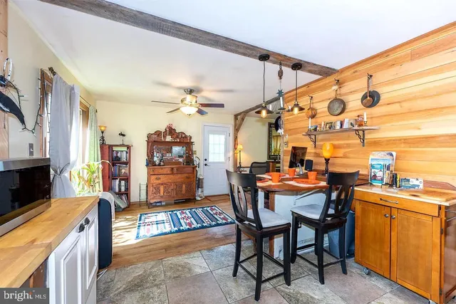 a dining room with furniture and chandelier