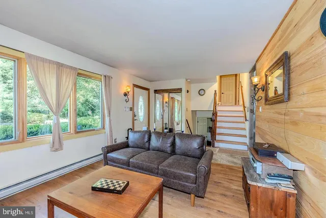 a living room with furniture and a large window