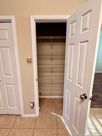 a view of a kitchen with a sink and a window