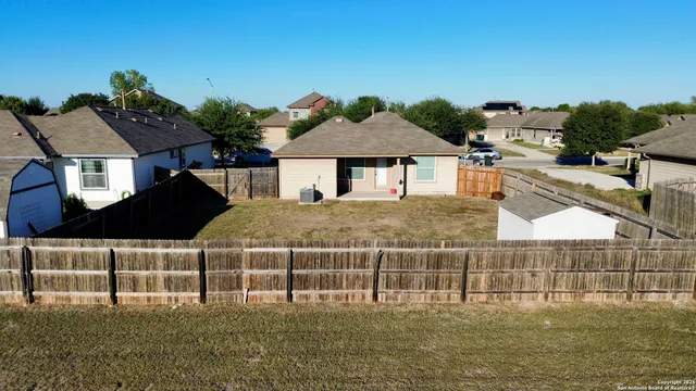 a view of a floor to ceiling window with potted plants