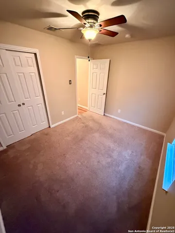 a bathroom with a sink and mirror with bathtub