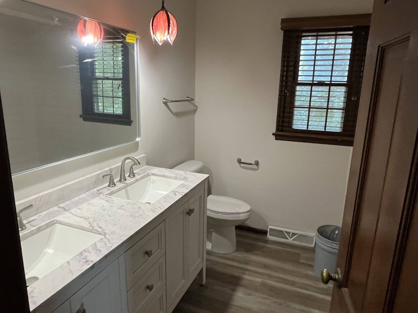 1019 Gregory Street Normal, IL 61761 - Photo 29 of 60 a bathroom with a sink a toilet and a mirror