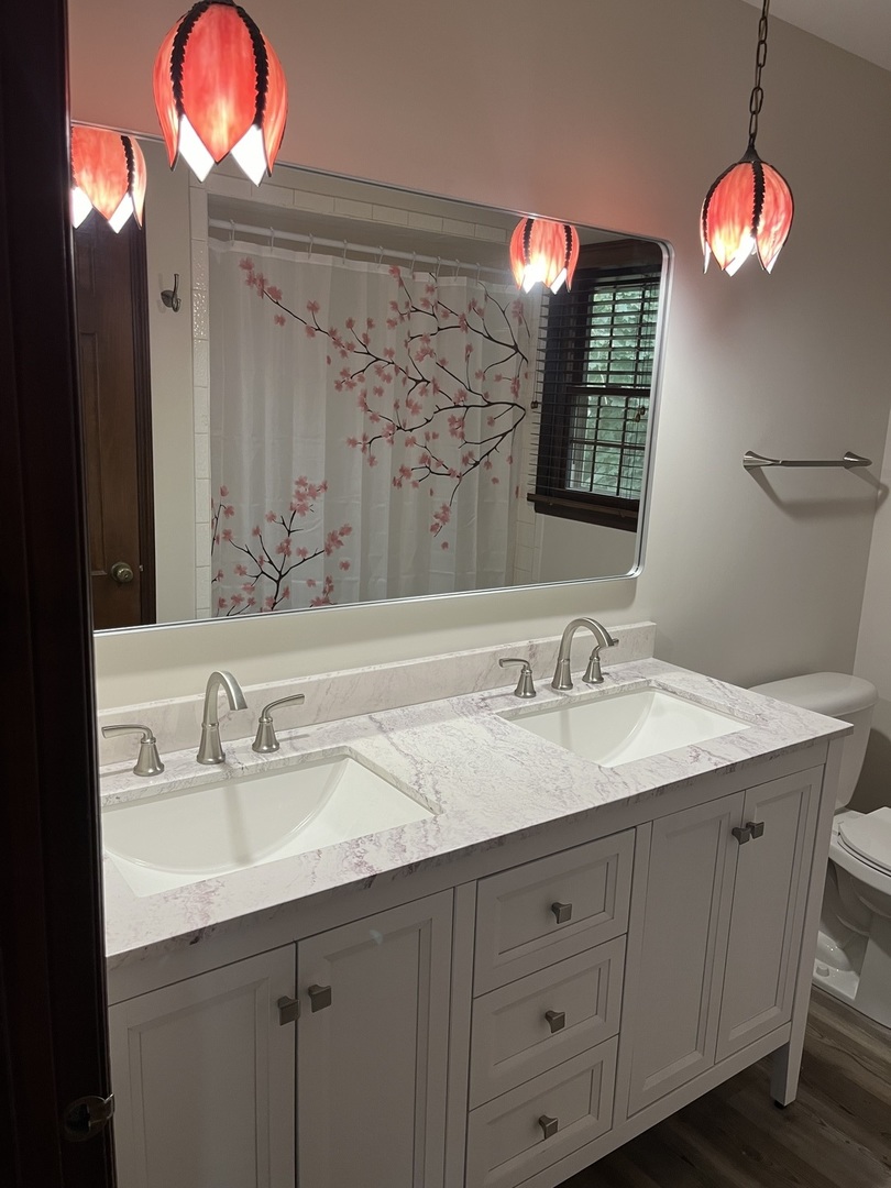 1019 Gregory Street Normal, IL 61761 - Photo 31 of 60 a bathroom with a sink vanity and a mirror