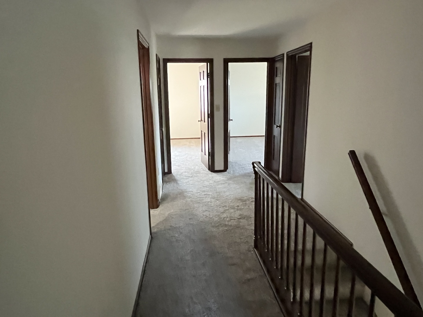 1019 Gregory Street Normal, IL 61761 - Photo 33 of 60 a view of a hallway with wooden floor and stairs
