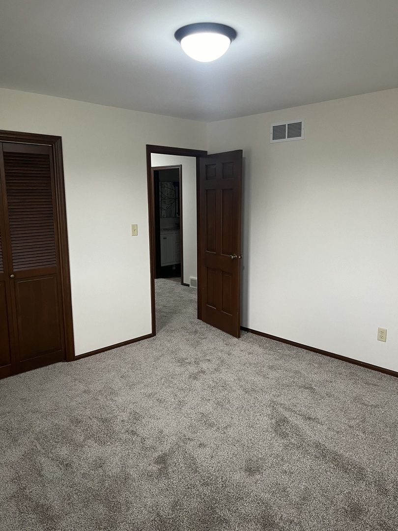 1019 Gregory Street Normal, IL 61761 - Photo 44 of 60 an empty room with closet