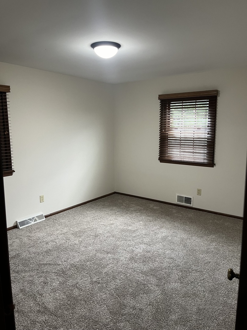 1019 Gregory Street Normal, IL 61761 - Photo 46 of 60 an empty room with a window