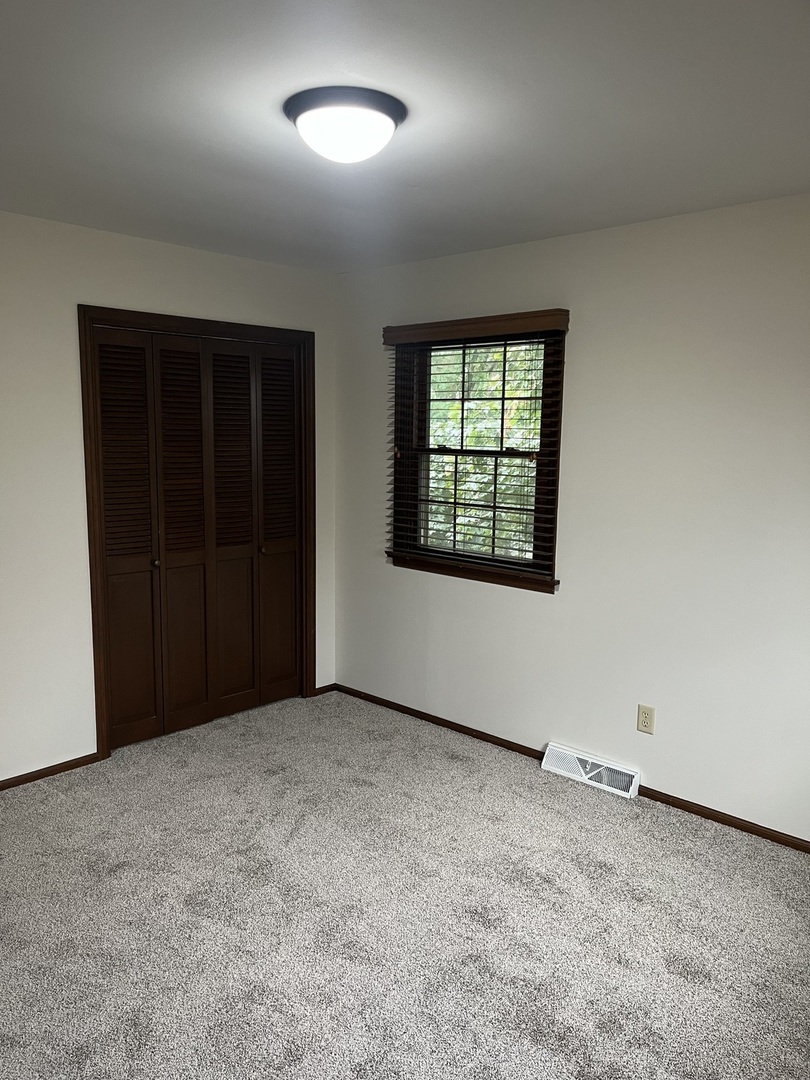 1019 Gregory Street Normal, IL 61761 - Photo 47 of 60 an empty room with windows