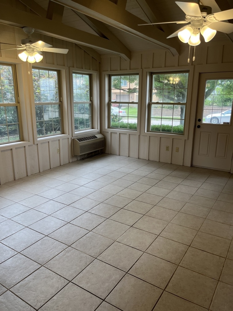 1019 Gregory Street Normal, IL 61761 - Photo 53 of 60 an empty room with windows and view of a bathtub