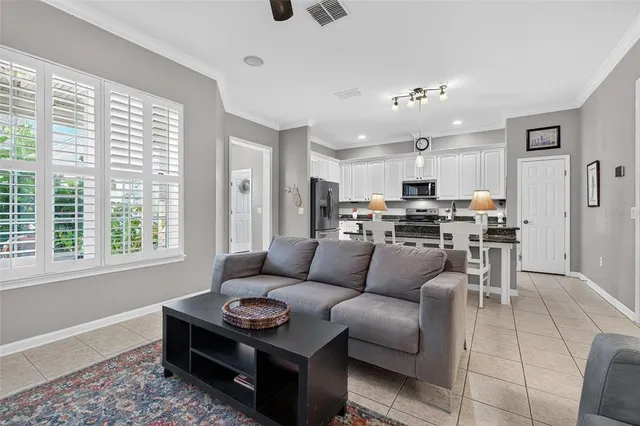 a kitchen with stainless steel appliances a stove a sink refrigerator and a cabinets