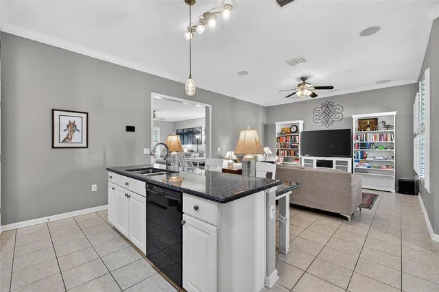a bedroom with a bed a table and book shelf