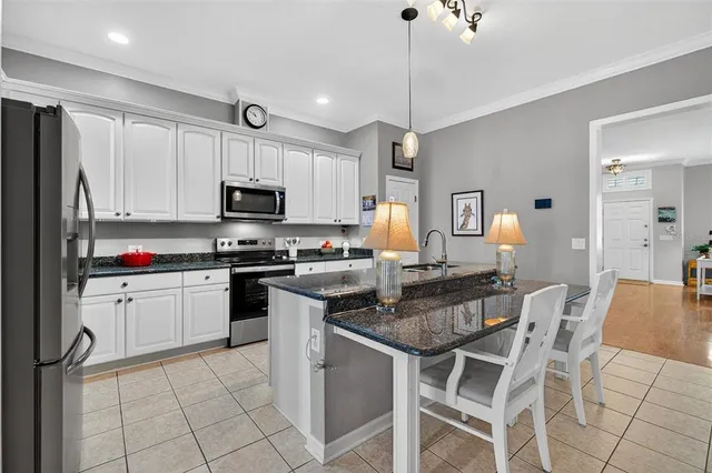 a bedroom with bed and a lamp