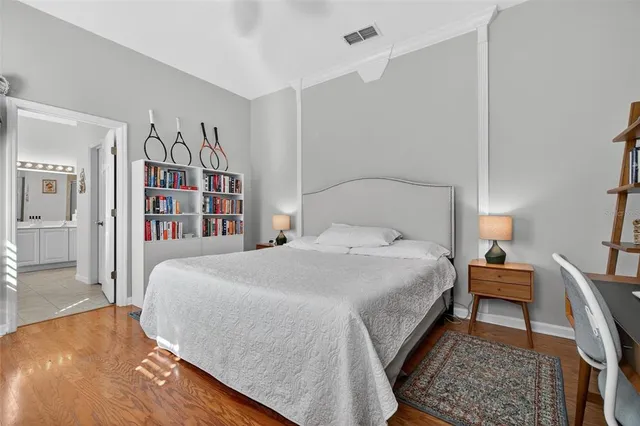 a bathroom with a tub a sink and mirror