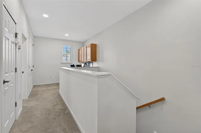 a view of a chair and table in the balcony