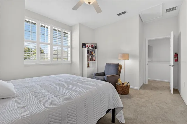 a view of a big room with dining table chairs and a chandelier
