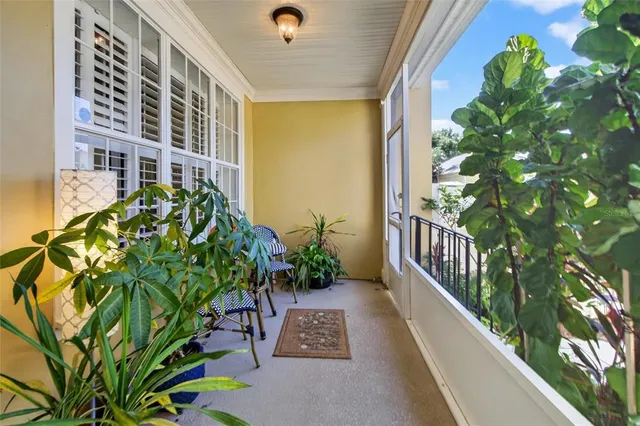 a view of a patio with table and chairs and potted plants