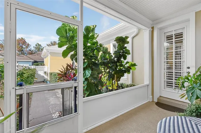 an aerial view of a house with swimming pool and outdoor seating