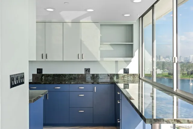 a kitchen with a refrigerator and a sink