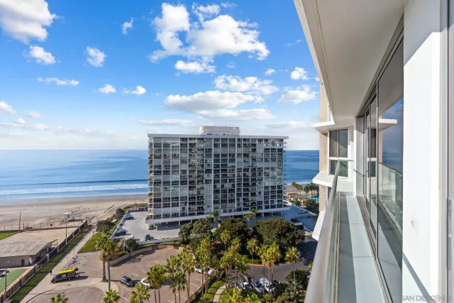 a view of a city with tall buildings and lake