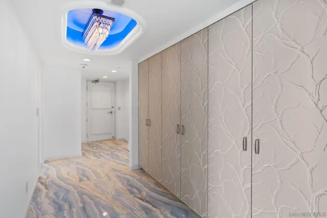 a view of a hallway with a painting on the wall