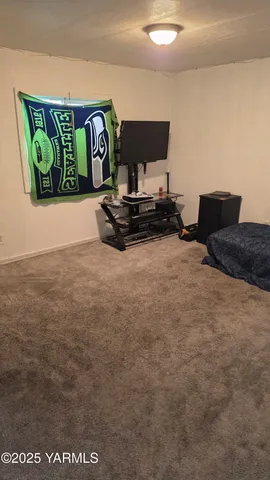 a view of living room with furniture and rug