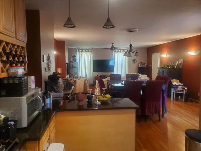 a living room with lots of furniture and a chandelier