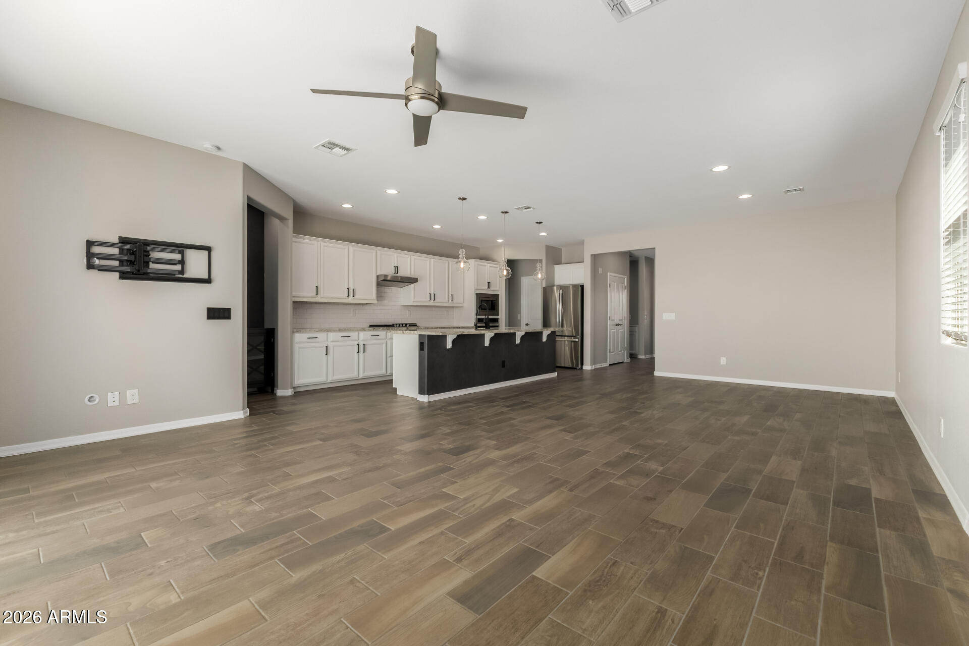 17771 West Granite View Drive Goodyear, AZ 85338 - Photo 11 of 35 a view of a kitchen with a sink and a refrigerator
