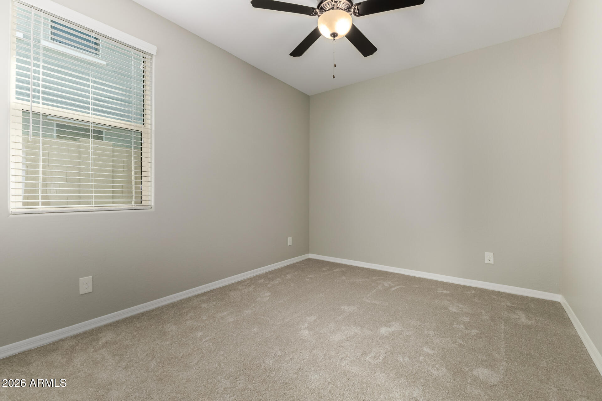 17771 West Granite View Drive Goodyear, AZ 85338 - Photo 25 of 35 an empty room with a window