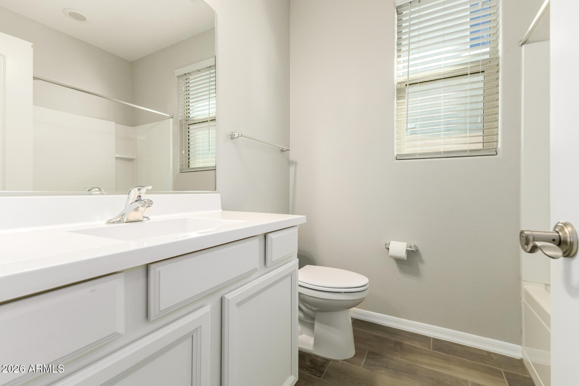 17771 West Granite View Drive Goodyear, AZ 85338 - Photo 28 of 35 a bathroom with a sink toilet and vanity