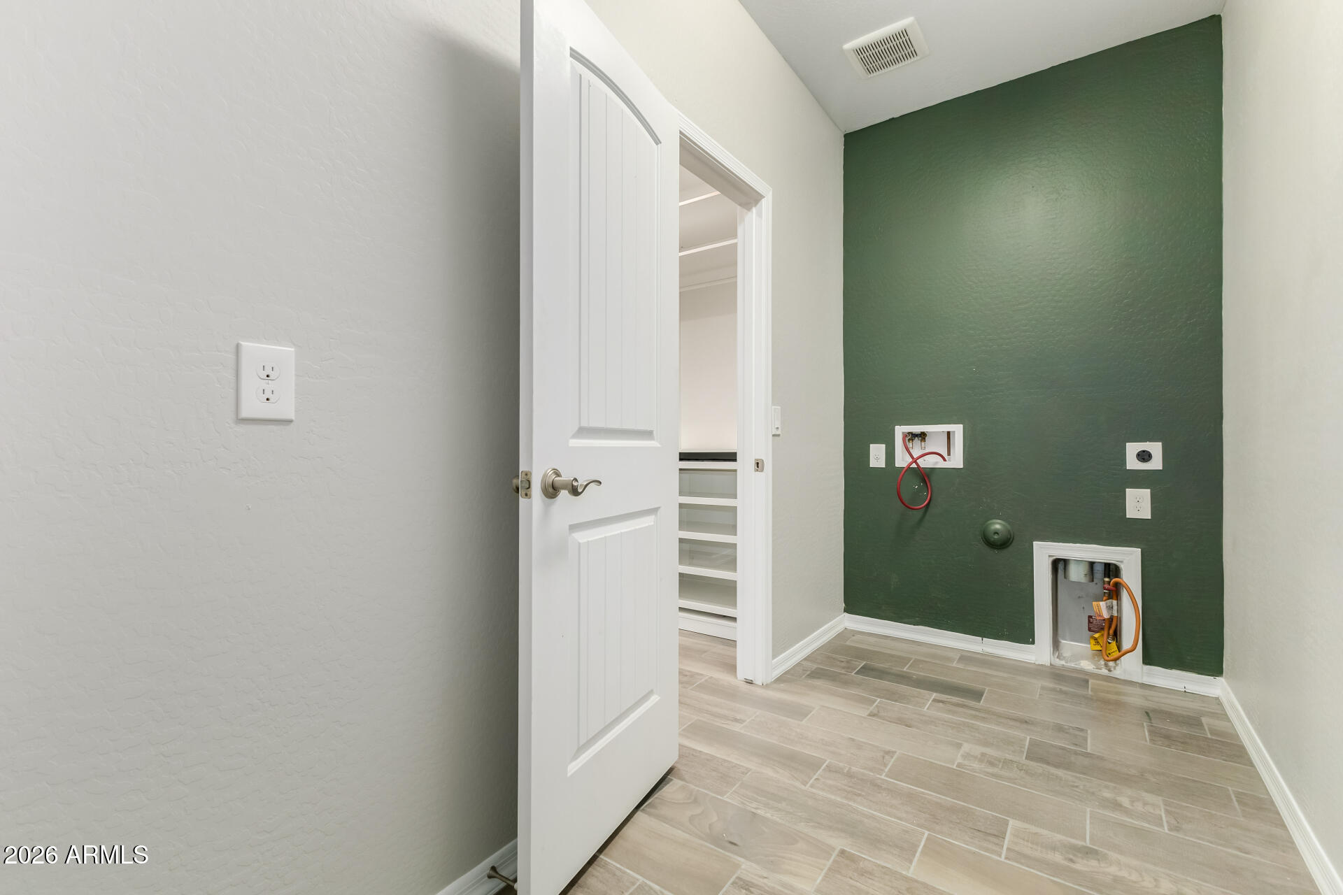 17771 West Granite View Drive Goodyear, AZ 85338 - Photo 29 of 35 a view of a hallway with wooden shelves