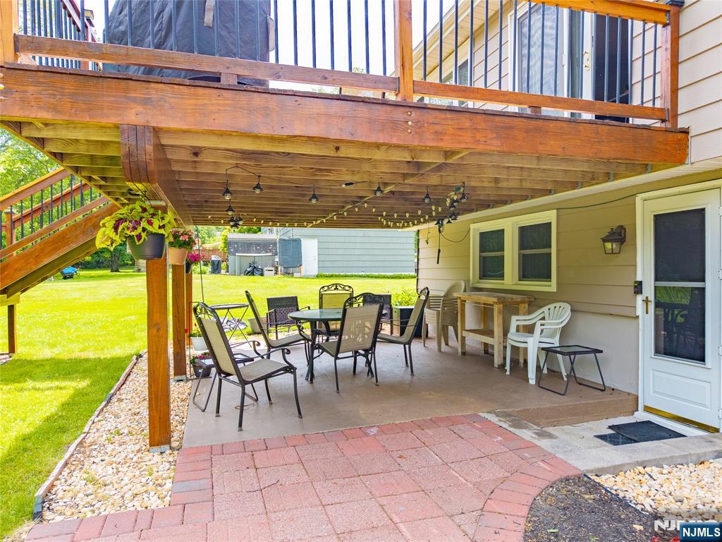 55 Marcia Road Ringwood, NJ 07456 - Photo 31 of 42 a view of a patio with a table and chairs