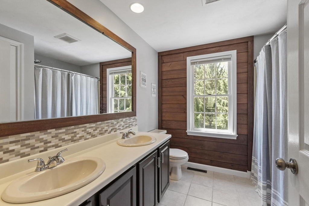 4 Ridge Road Pepperell, MA 01463 - Photo 27 of 42 a bathroom with a sink double vanity and a mirror