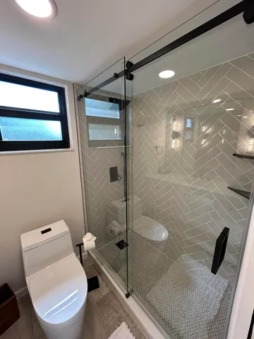 a view of a hallway with washer and dryer