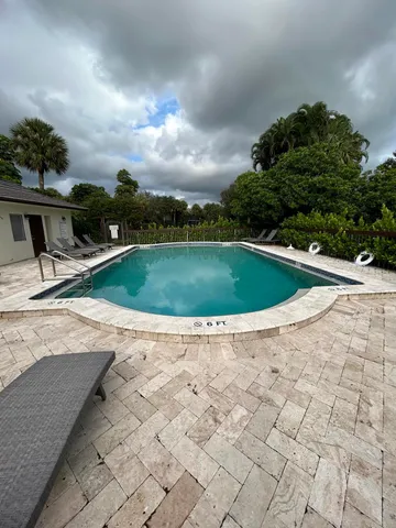 a view of swimming pool with a yard