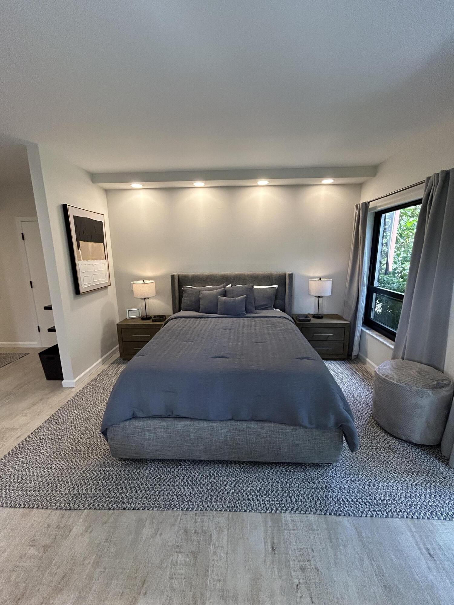 13334 Polo Club Road, Unit 203 Wellington, FL 33414 - Photo 5 of 19 a bedroom with a bed window and couch