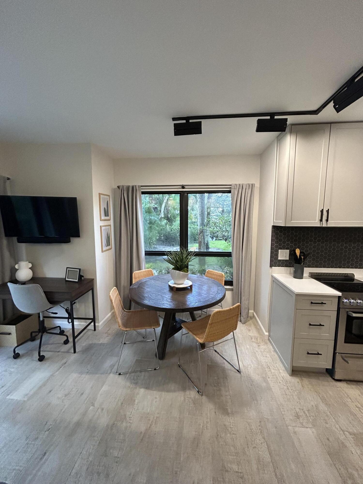 13334 Polo Club Road, Unit 203 Wellington, FL 33414 - Photo 10 of 19 a view of a livingroom with workspace and a window