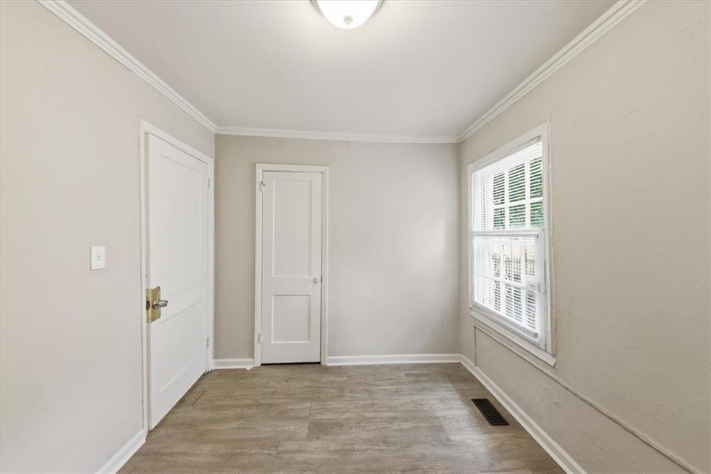 154 Lawton Street Southwest Atlanta, GA 30314 - Photo 17 of 23 an empty room with windows