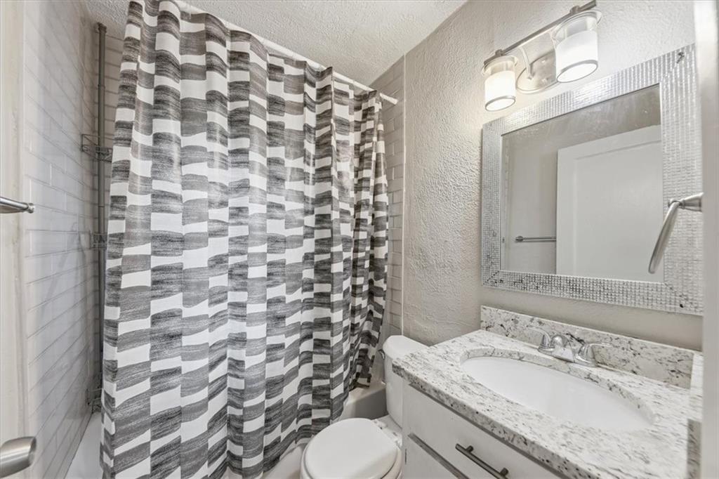 154 Lawton Street Southwest Atlanta, GA 30314 - Photo 19 of 23 a bathroom with a sink toilet and shower