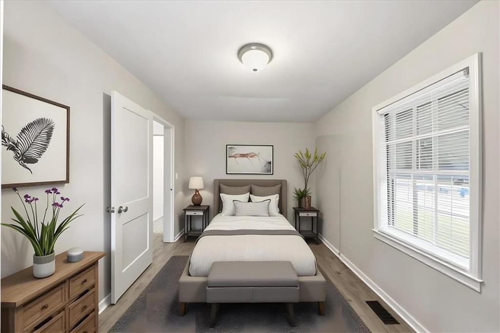 154 Lawton Street Southwest Atlanta, GA 30314 - Photo 20 of 23 a bedroom with furniture and window