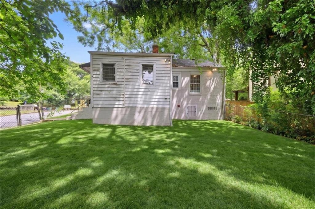154 Lawton Street Southwest Atlanta, GA 30314 - Photo 22 of 23 front view of a house with a yard