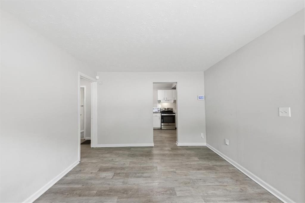 154 Lawton Street Southwest Atlanta, GA 30314 - Photo 8 of 23 wooden floor in an empty room