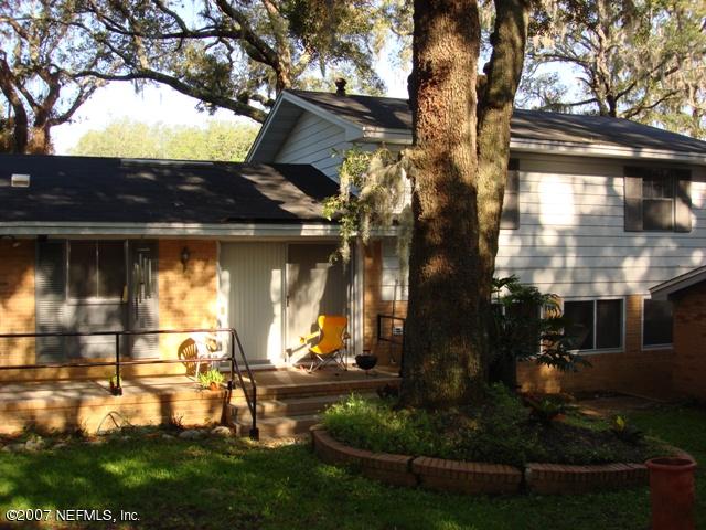 4641 Morris Road Jacksonville, FL 32225 - Photo 13 of 13 front view of house with a yard and potted plants