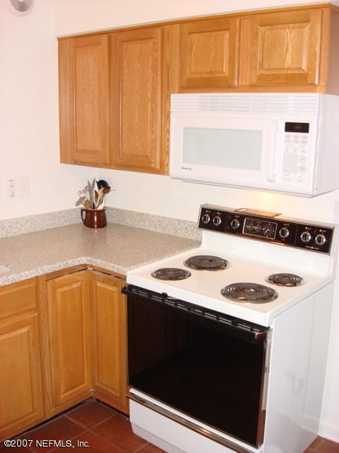 4641 Morris Road Jacksonville, FL 32225 - Photo 5 of 13 a kitchen with a sink and a stove top oven