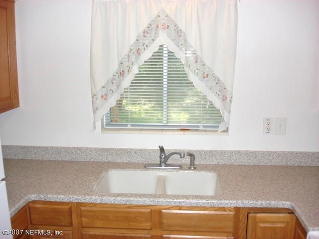 4641 Morris Road Jacksonville, FL 32225 - Photo 7 of 13 a view of a kitchen sink and dishwasher