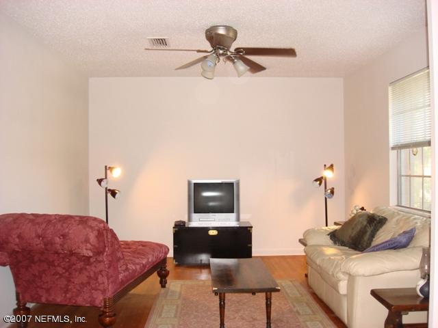 4641 Morris Road Jacksonville, FL 32225 - Photo 8 of 13 a living room with furniture and a window