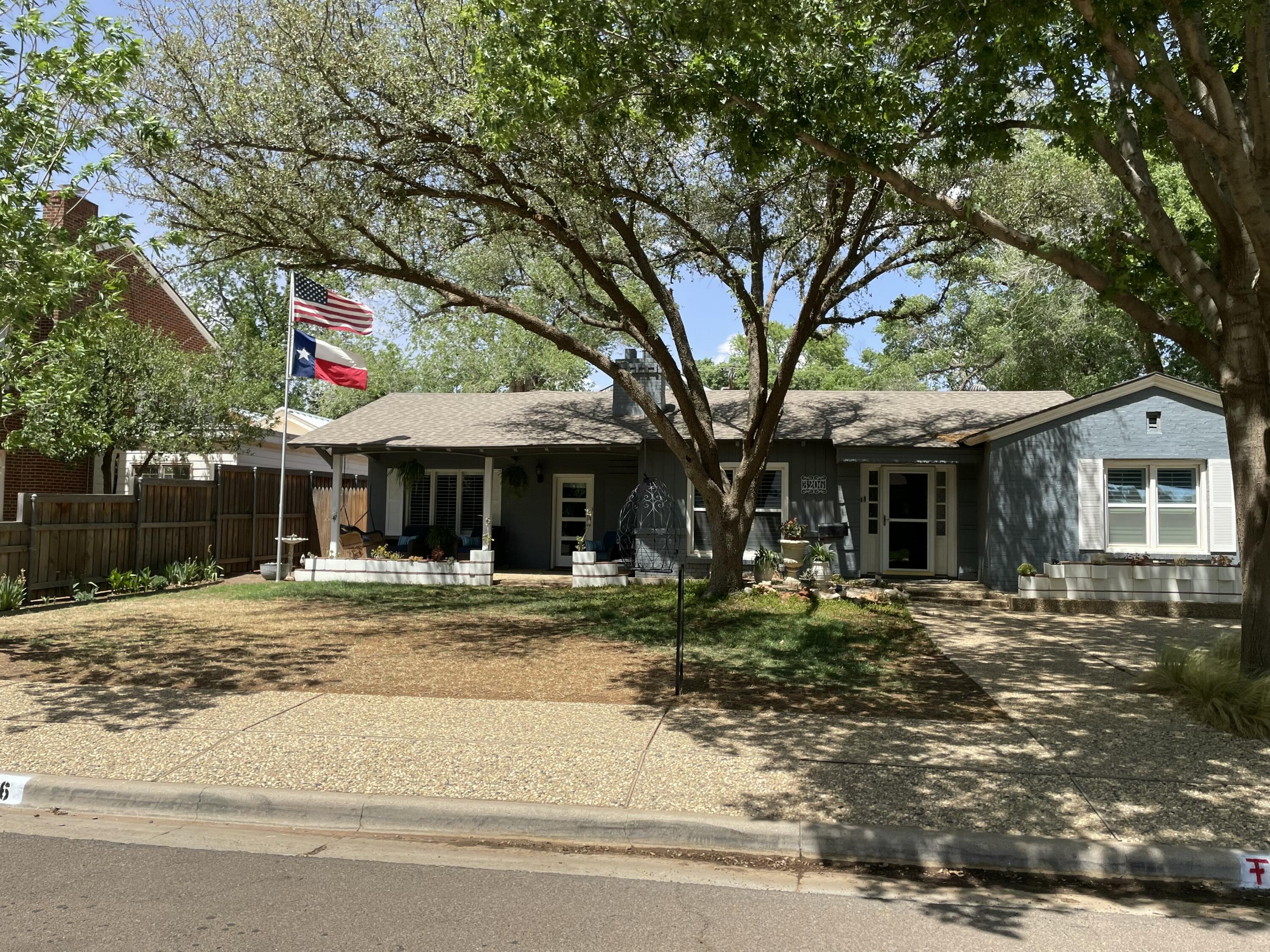 3206 21st Street Lubbock, TX 79410 - Photo 1 of 70 a front view of a house with a yard