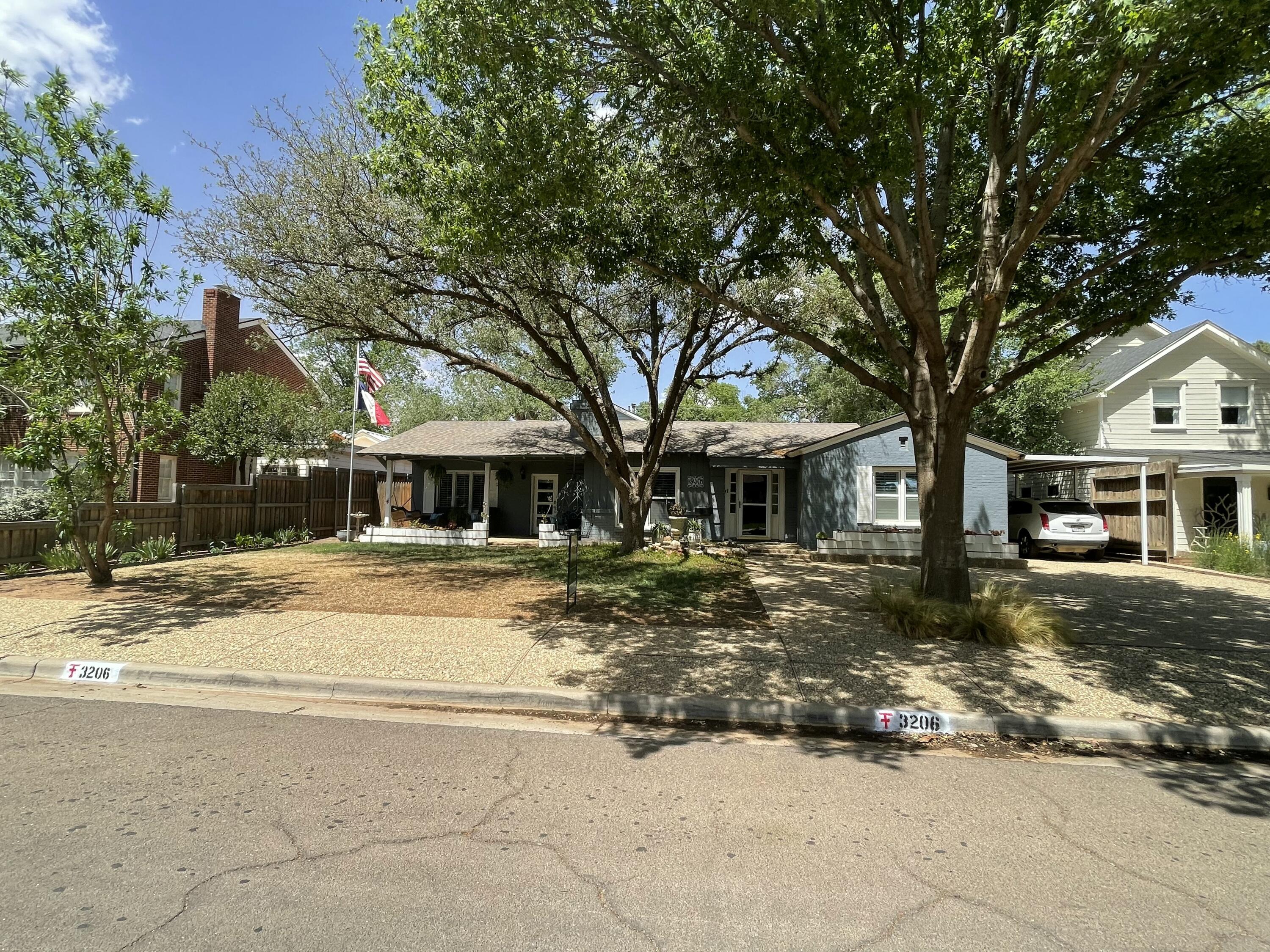 3206 21st Street Lubbock, TX 79410 - Photo 2 of 70 a view of a house with snow on the tree