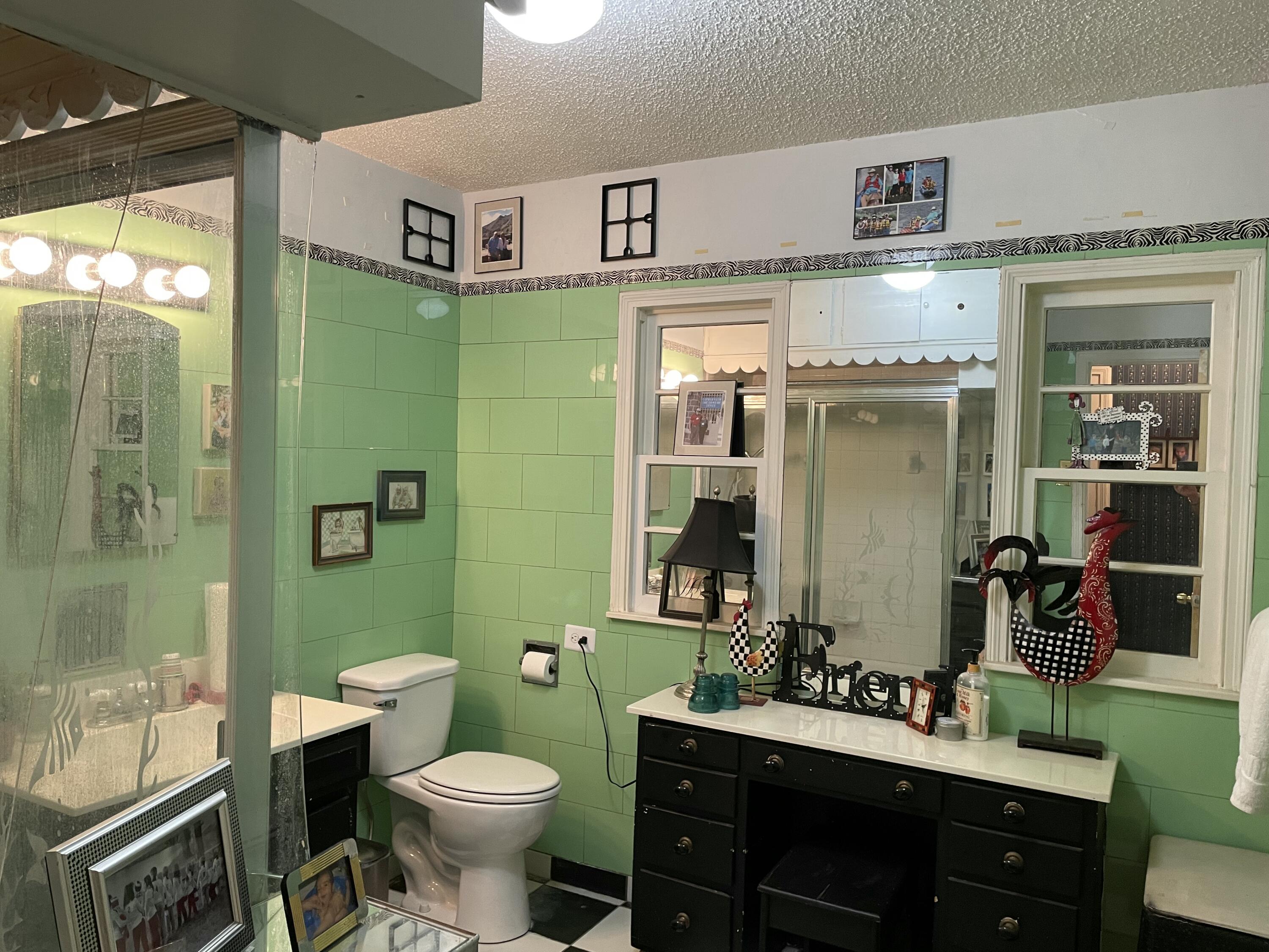 3206 21st Street Lubbock, TX 79410 - Photo 27 of 70 a bathroom with a sink toilet and shower