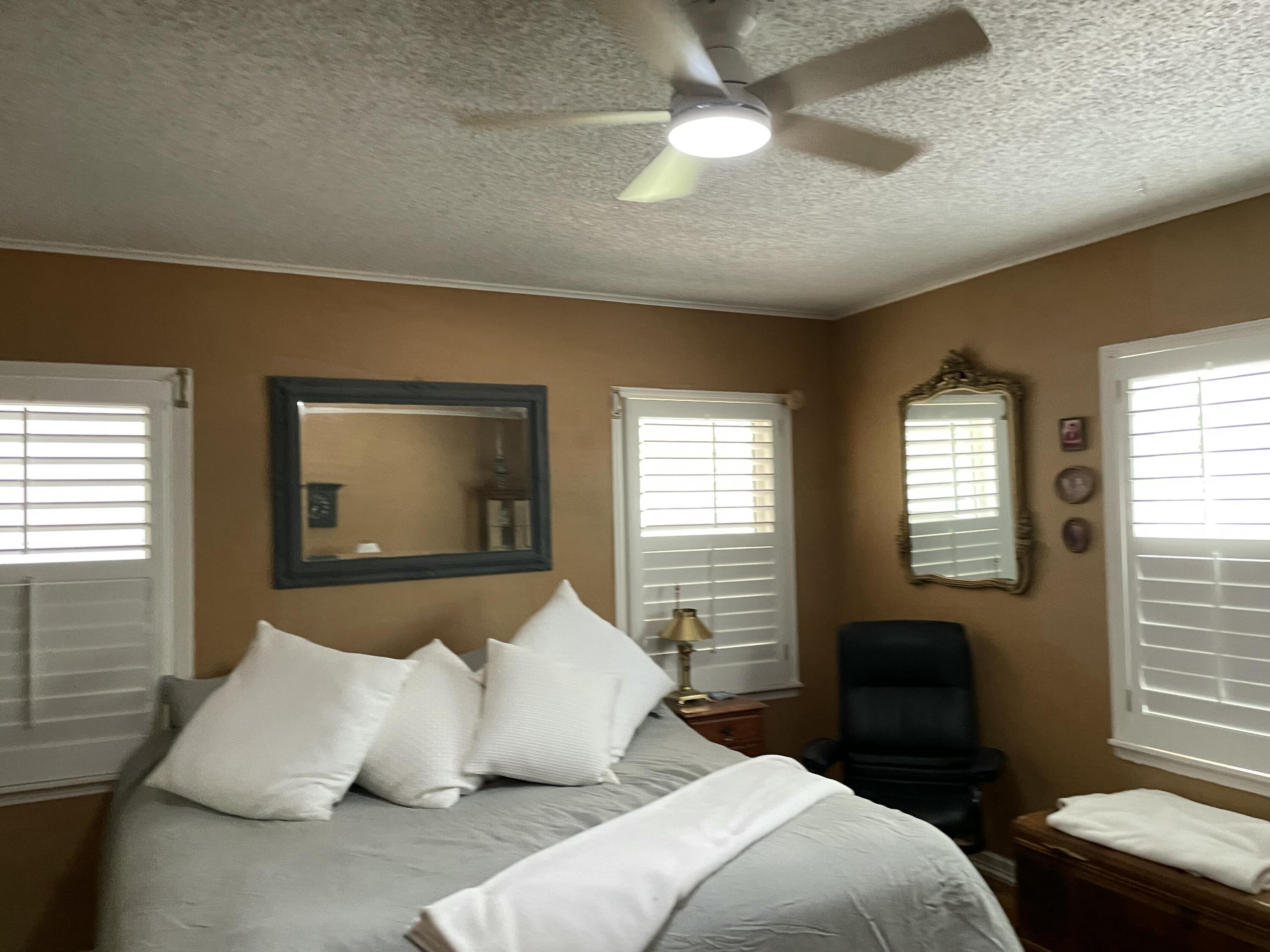 3206 21st Street Lubbock, TX 79410 - Photo 30 of 70 a bedroom with a bed and a window