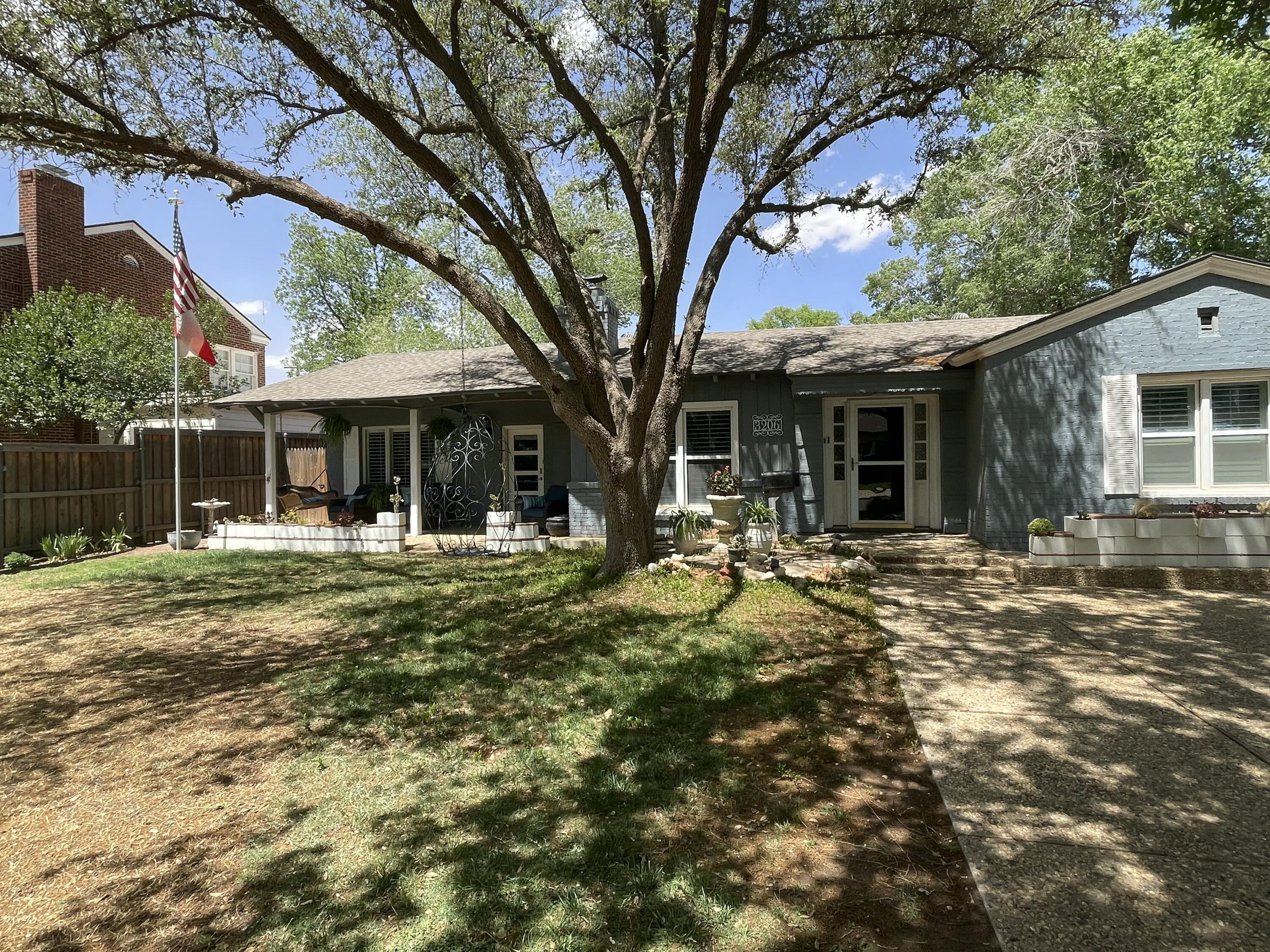 3206 21st Street Lubbock, TX 79410 - Photo 3 of 70 a front view of a house with garden